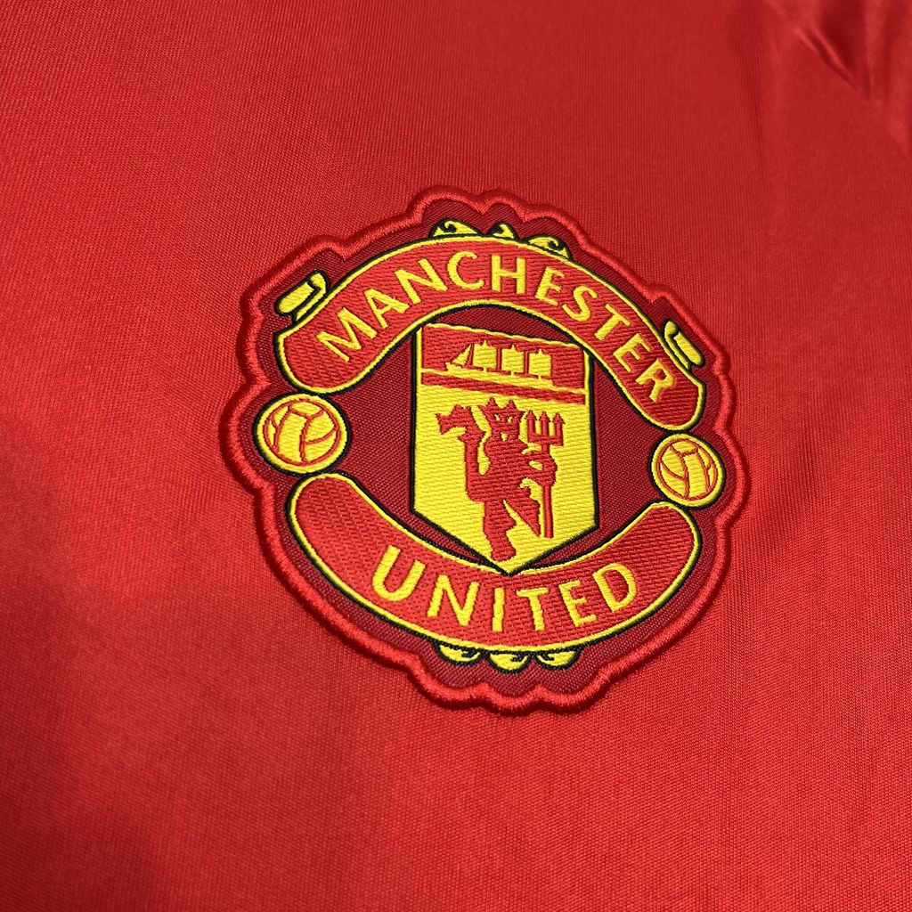 Camisa vermelha pré-jogo Manchester United 2024/25