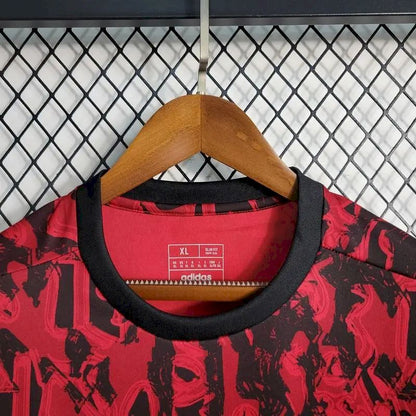 Camisa de treino pré-jogo do Manchester United 2023/24 vermelha e preta