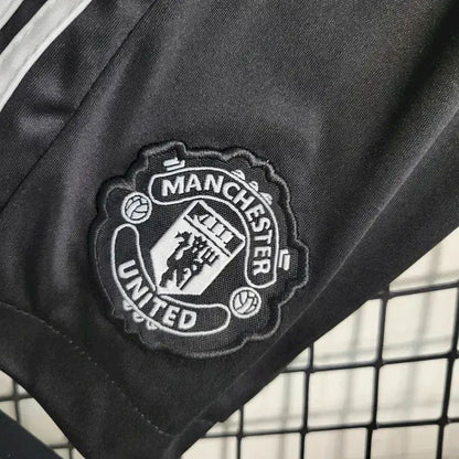 Kit reserva infantil do Manchester United 2023/24